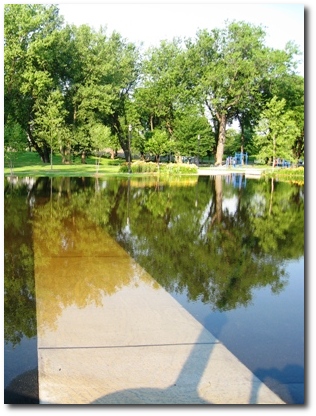 Storm water overtakes a sidewalk at Riverfront Park