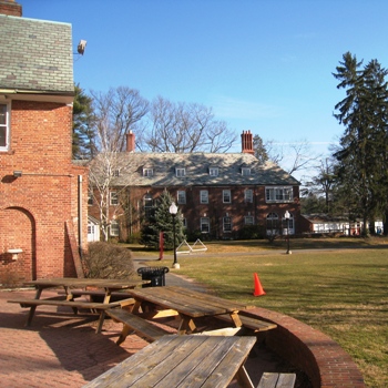 Looking from the back patio of Johnson House towards Butterworth Hall